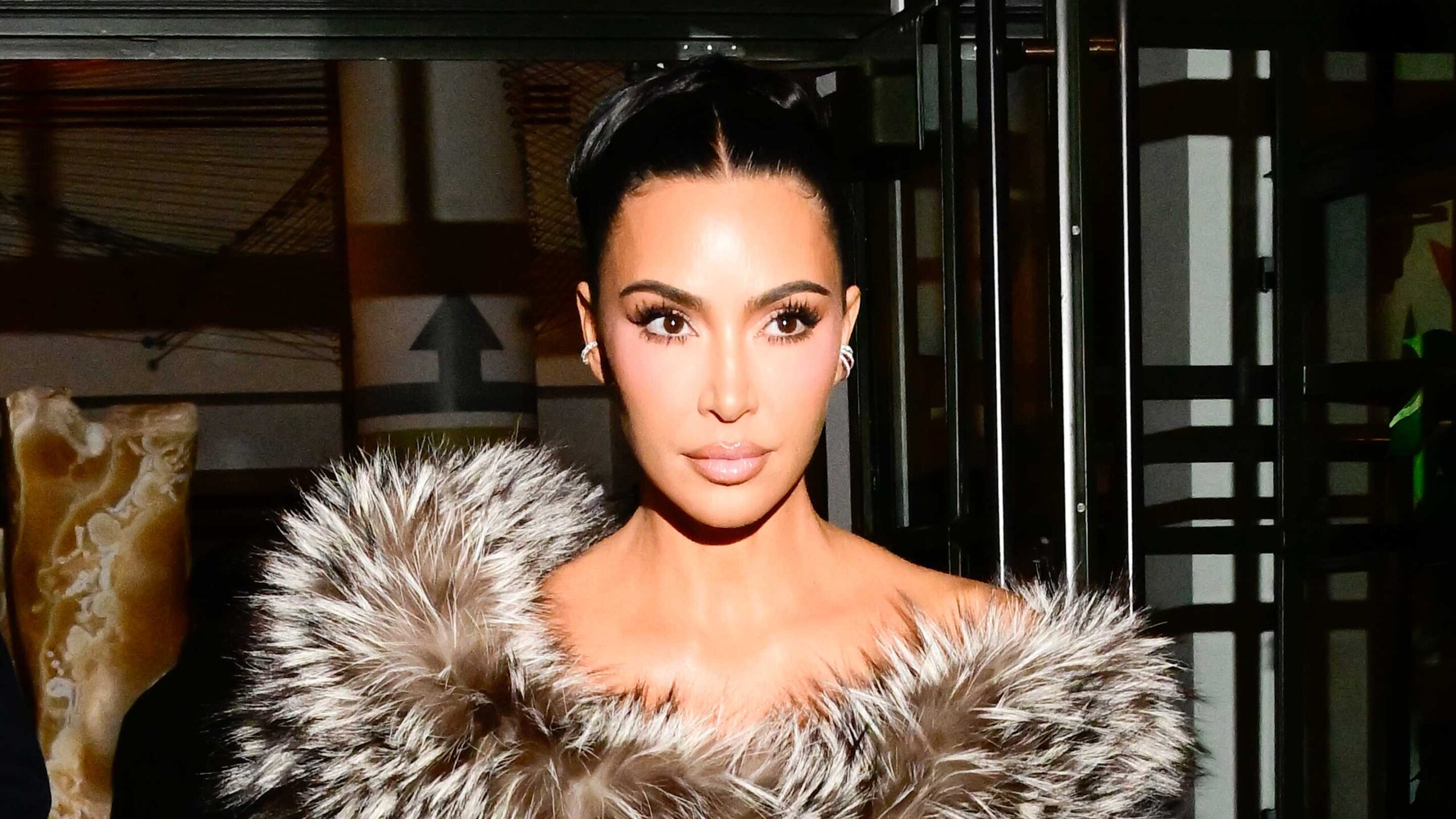 Kim Kardashian Stylishly References ‘00s Look With Daring Neon Gown for Brazil Trip