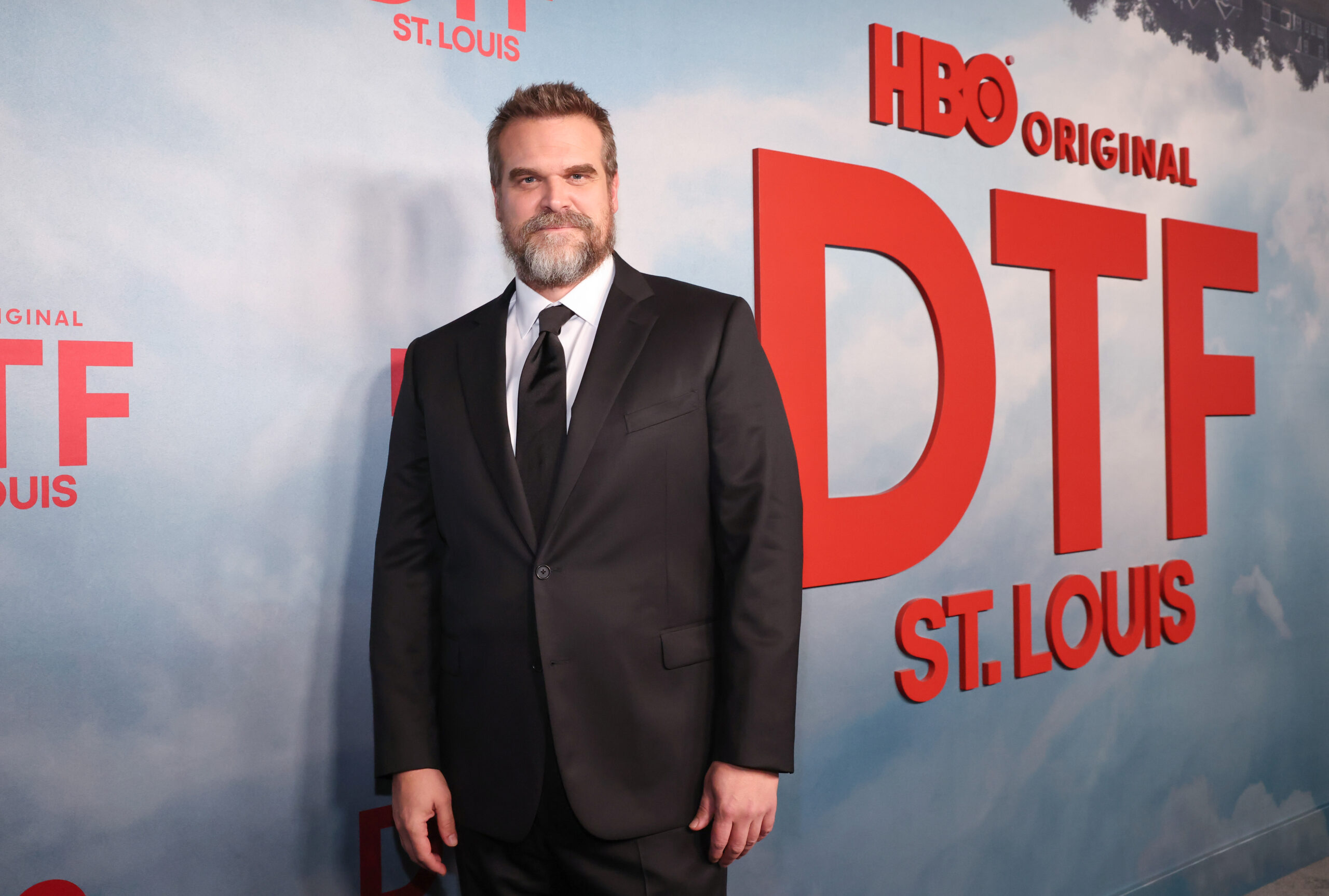 David Harbour Has a New Dark Comedy About Swingers and “Weird People Looking for Meaning”
