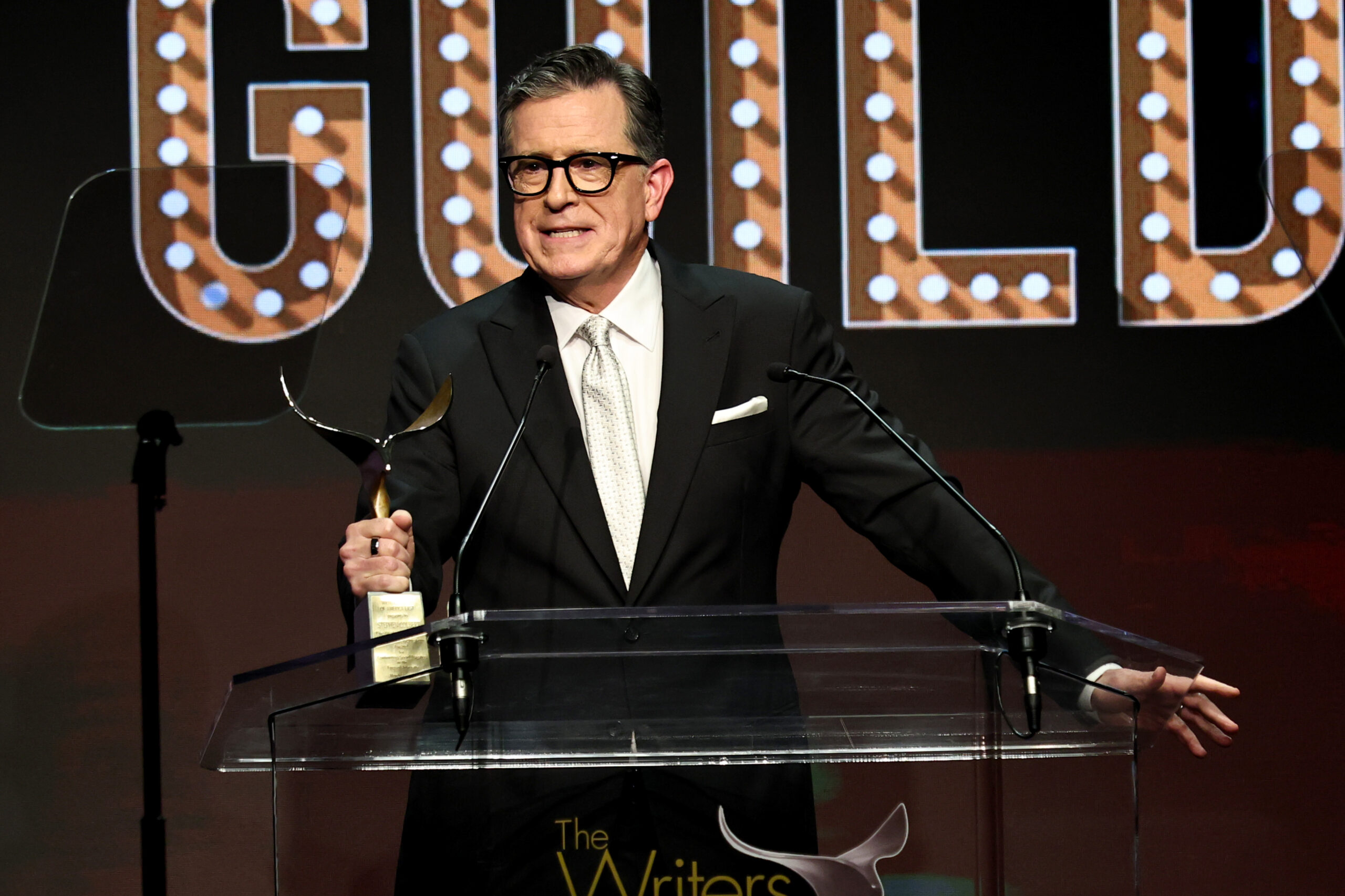 Stephen Colbert Rejects “Implied Parallel” to Blacklisted Screenwriter Walter Bernstein While Receiving Writers Guild Awards Honor
